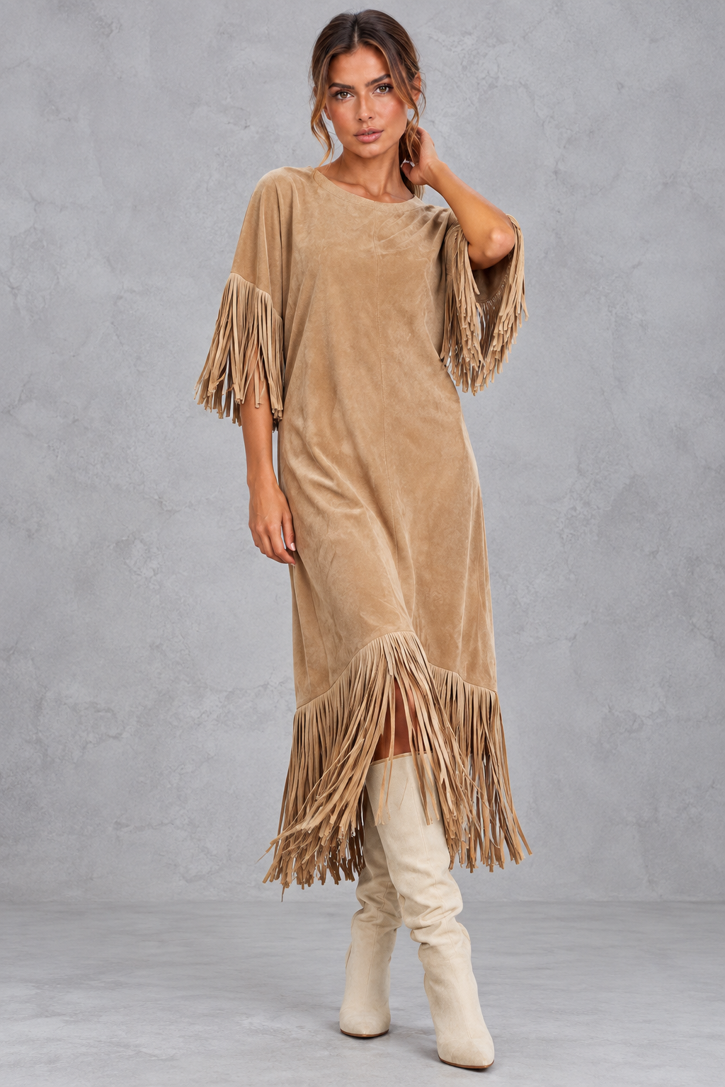 Women's Western-inspired fringe midi dress styled with ankle boots