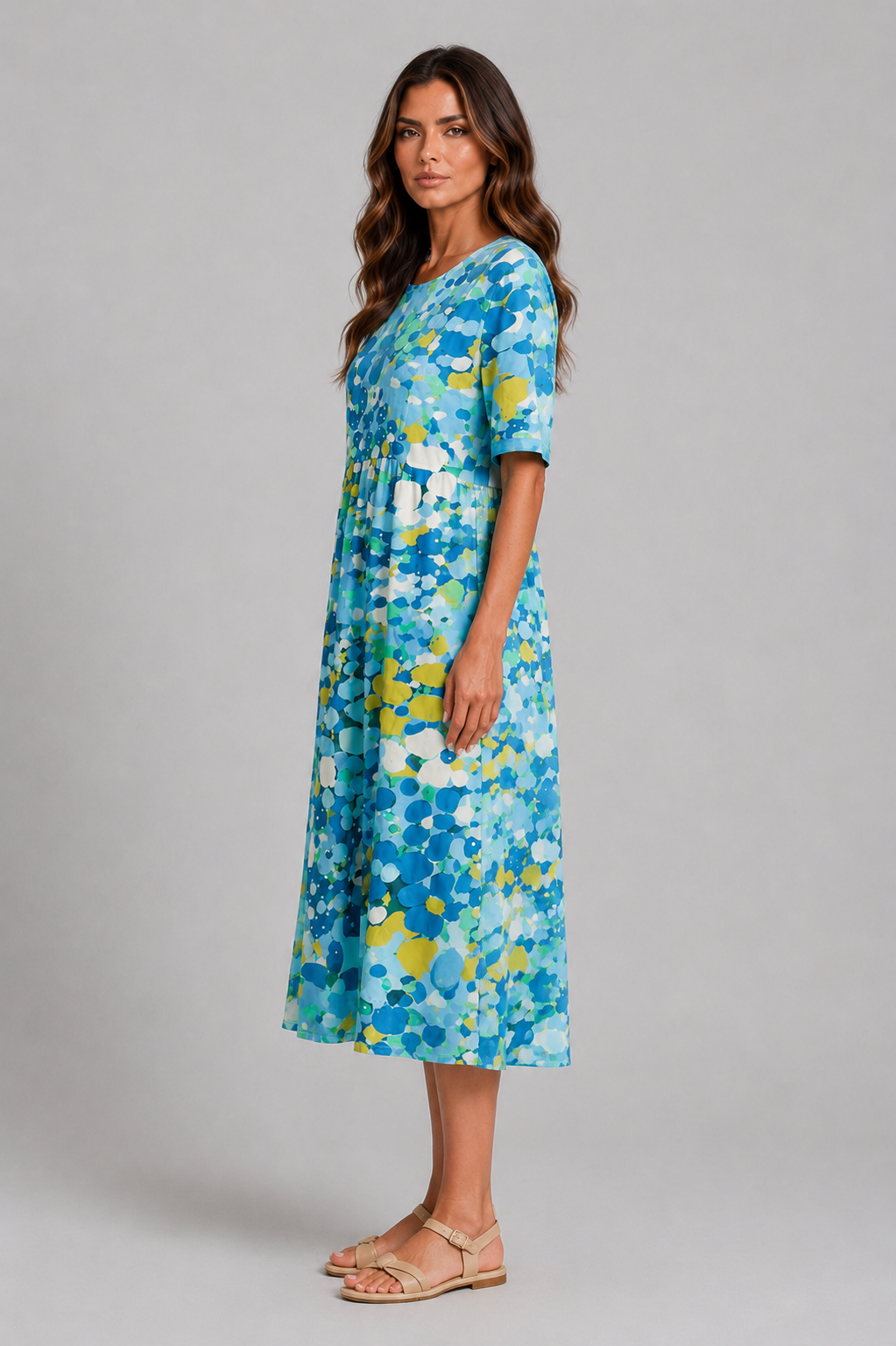 Women’s abstract print midi dress with round neckline, short sleeves, gathered waist, side pockets and a relaxed A-line silhouette.