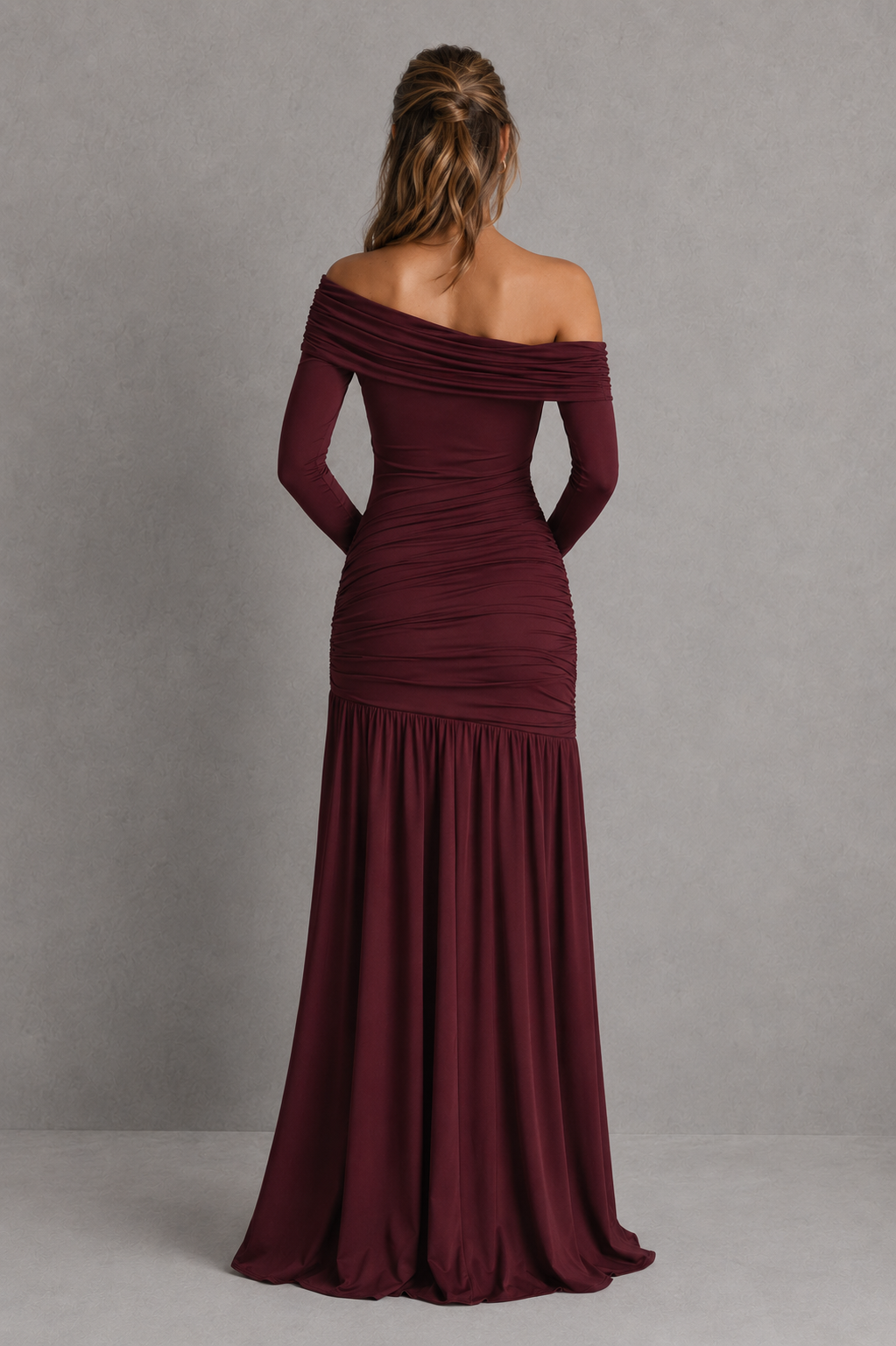 Women's asymmetric maxi dress in soft stretch slinky jersey featuring an asymmetric neckline, sheer mesh waist panel, ruched hip detailing, flowing gathered skirt, and flared sleeve cuffs for elegant evening and formal occasions.