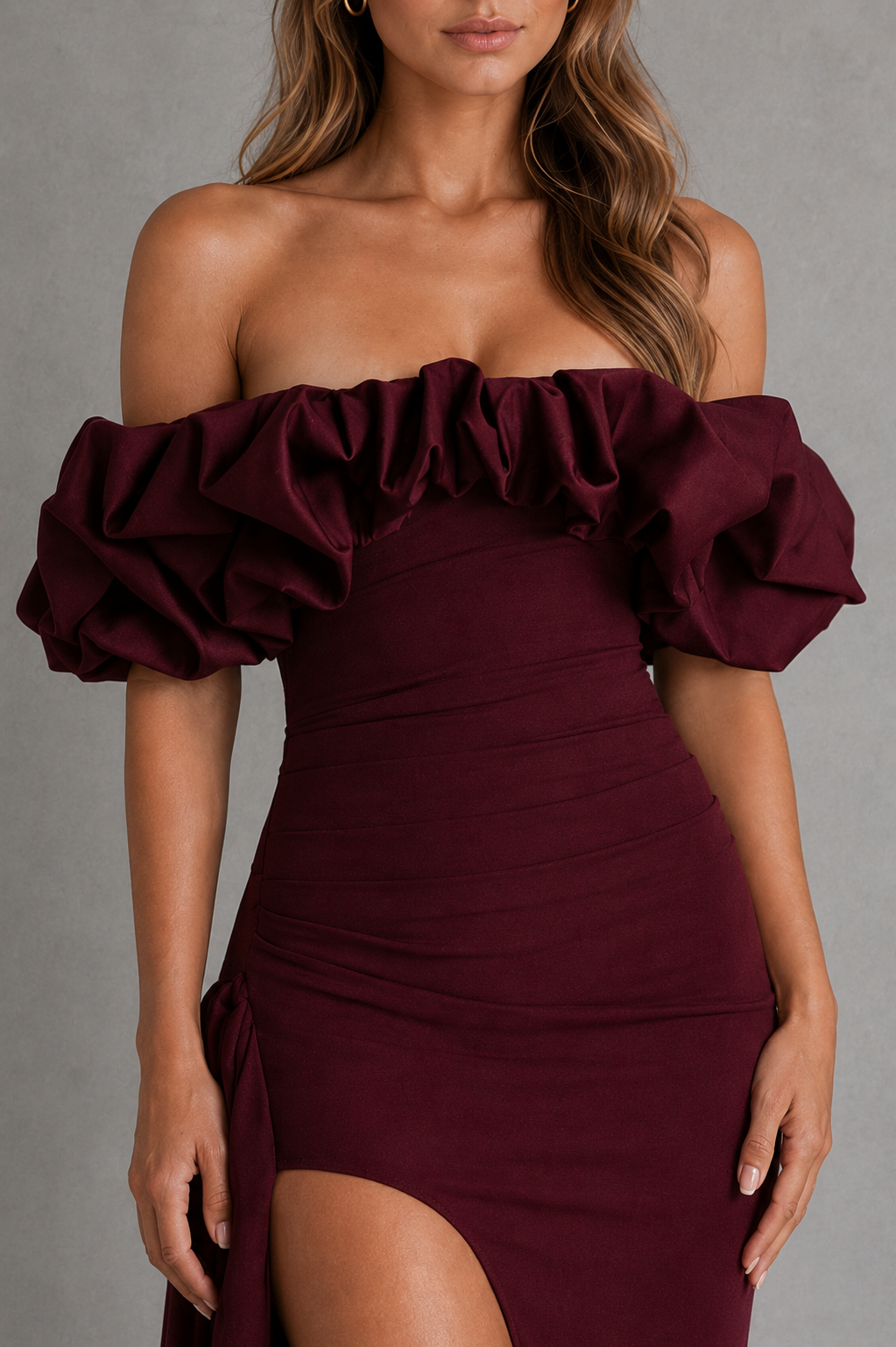 Women's Bardot maxi dress in stretch crepe with a voluminous satin ruffle off-the-shoulder neckline, asymmetrical pleated waist, fitted bodice, draped thigh-high split, and flowing maxi skirt for evening and formal occasions.