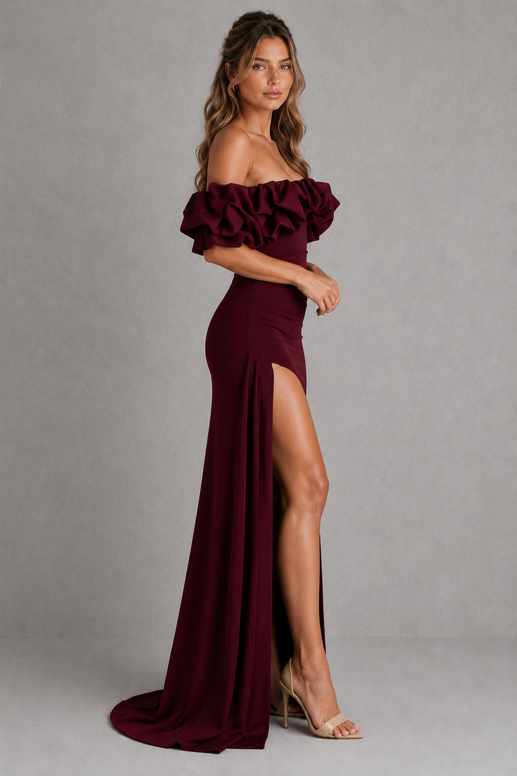 Women's Bardot maxi dress in stretch crepe with a voluminous satin ruffle off-the-shoulder neckline, asymmetrical pleated waist, fitted bodice, draped thigh-high split, and flowing maxi skirt for evening and formal occasions.