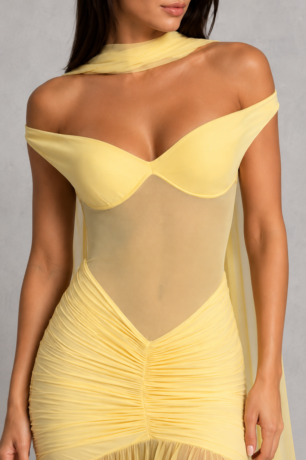 Women's bardot mesh maxi dress with sweetheart neckline, sheer mesh bodice, ruched hips, dropped waist, and dramatic thigh-high split. Elegant fitted evening gown with a flowing maxi skirt for formal events and special occasions.