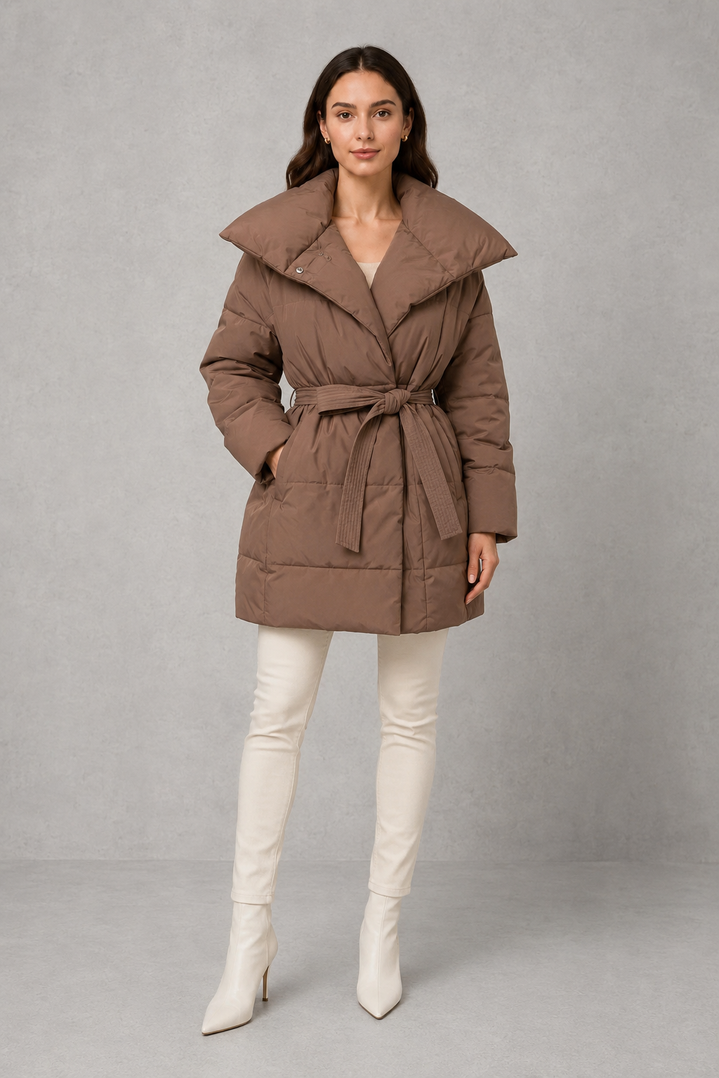 Women’s belted quilted puffer jacket with soft insulated padding, adjustable waist belt, full-length front zipper, and a flattering regular-fit silhouette.