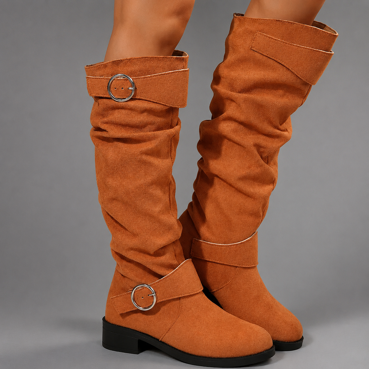 Women’s black slouch mid-calf boots with decorative buckle accents, relaxed shaft, slip-on design, soft textile lining, and durable rubber outsole.