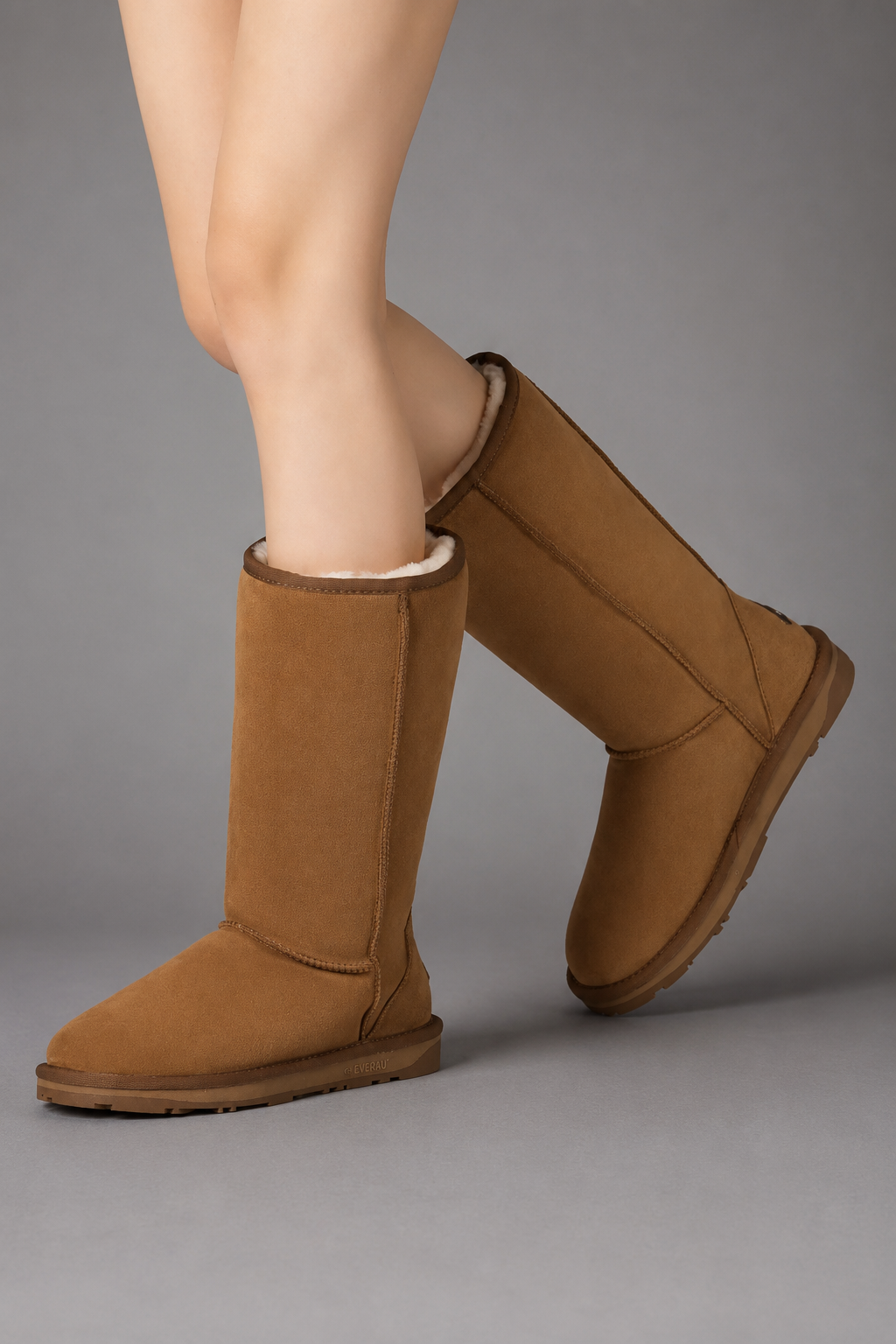 Women’s bow detail mid-calf snow boots with a soft faux fur upper, warm fleece lining, round toe, slip-on design, and flexible rubber sole.