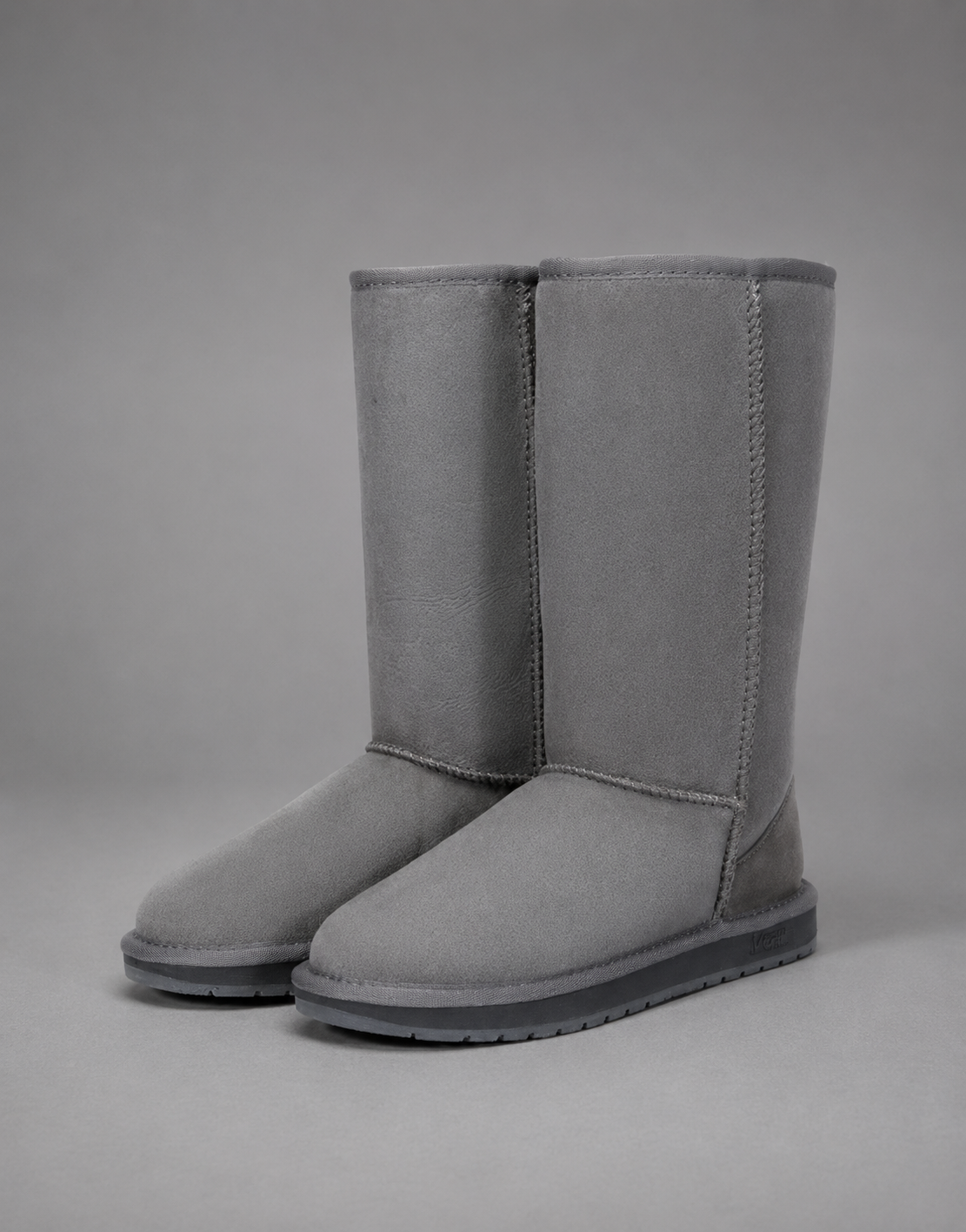 Women’s bow detail mid-calf snow boots with a soft faux fur upper, warm fleece lining, round toe, slip-on design, and flexible rubber sole.