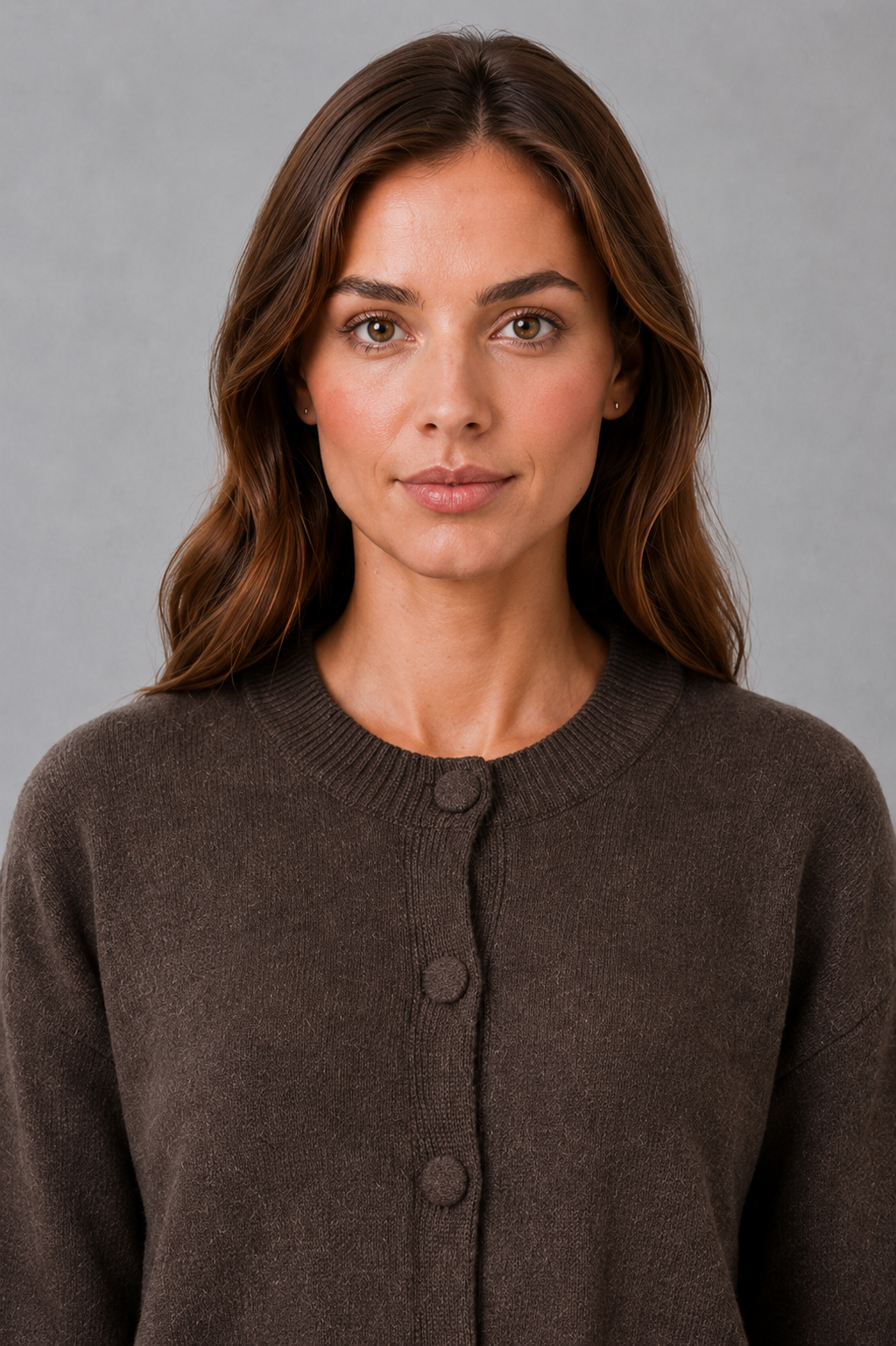 Women’s chunky knit cardigan with a thick textured finish, classic round neckline, long sleeves, and a relaxed loose-fit silhouette.