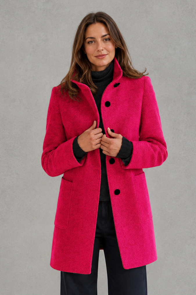 Women’s classic button-front longline coat with a tailored straight silhouette, regular fit and functional side pockets.