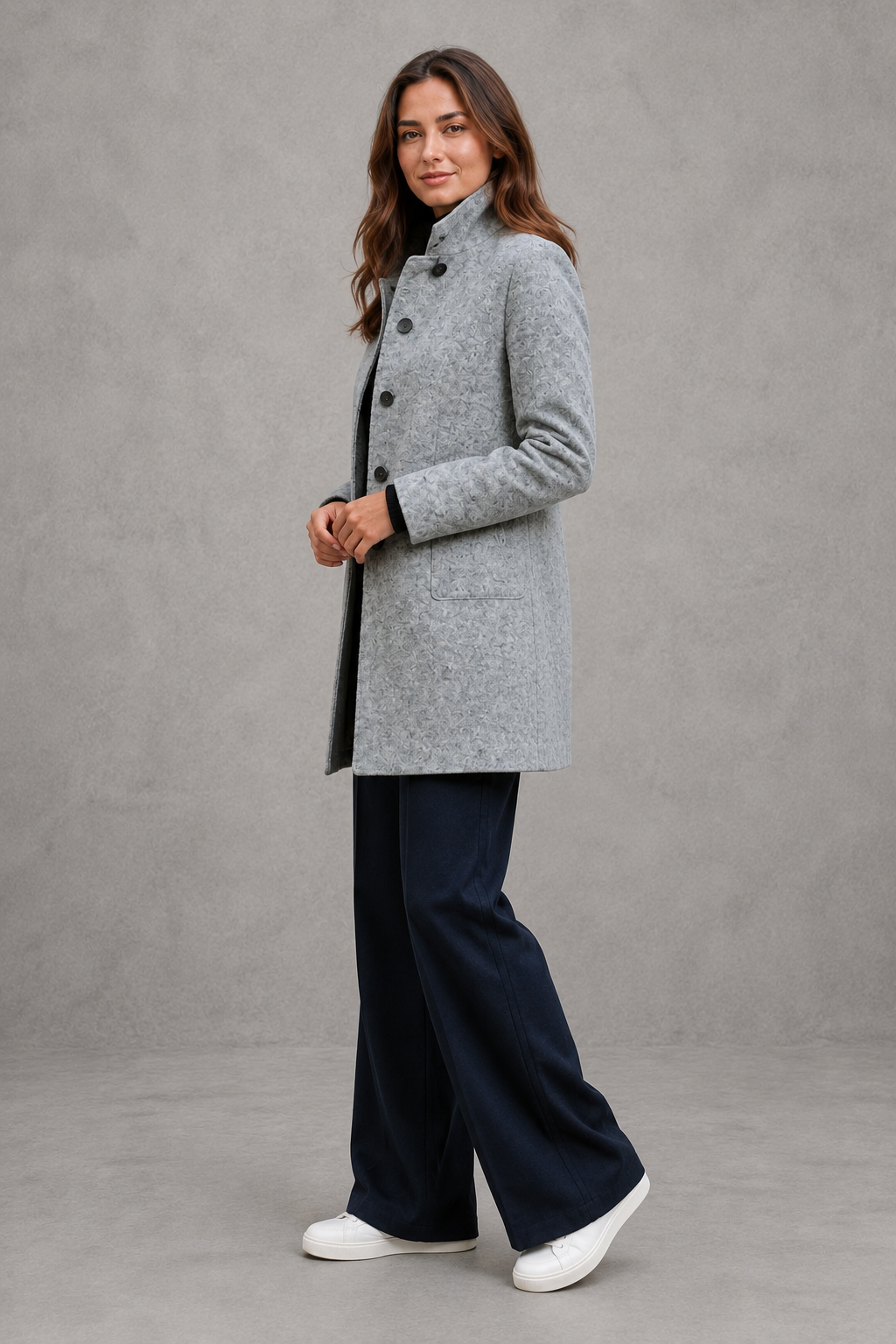 Women’s classic button-front longline coat with a tailored straight silhouette, regular fit and functional side pockets.