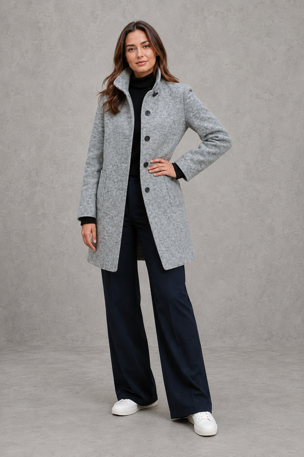 Women’s classic button-front longline coat with a tailored straight silhouette, regular fit and functional side pockets.