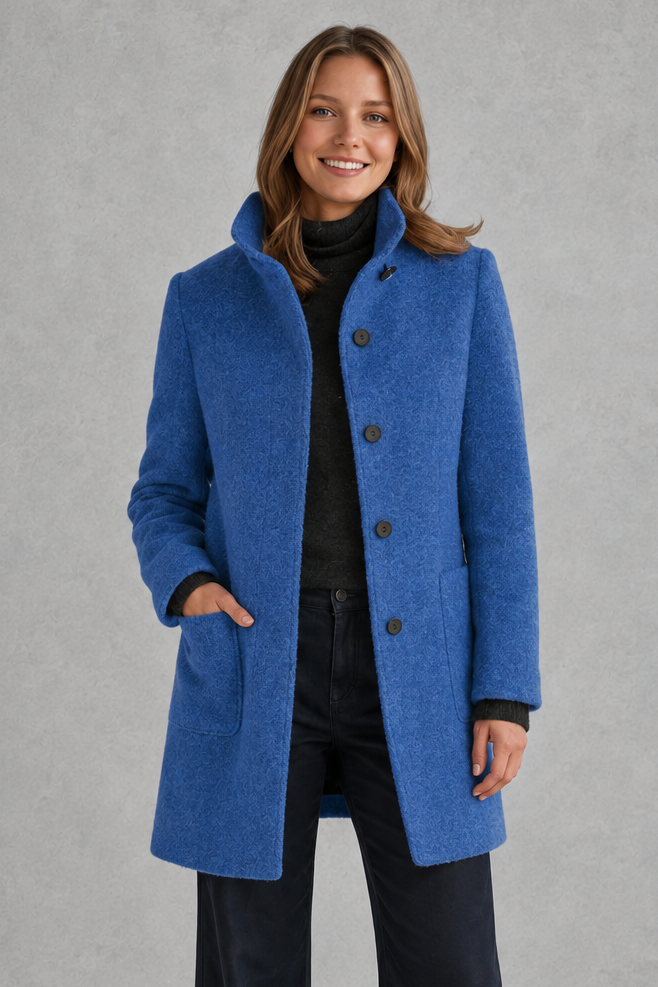 Women’s classic button-front longline coat with a tailored straight silhouette, regular fit and functional side pockets.