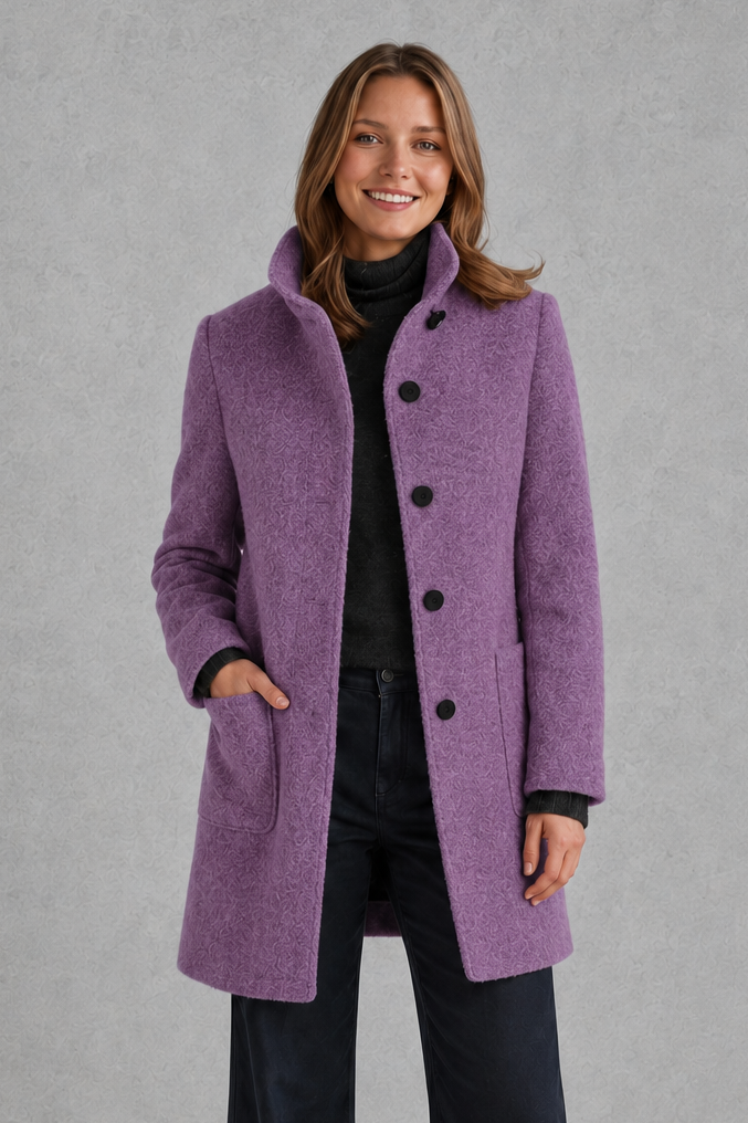 Women’s classic button-front longline coat with a tailored straight silhouette, regular fit and functional side pockets.