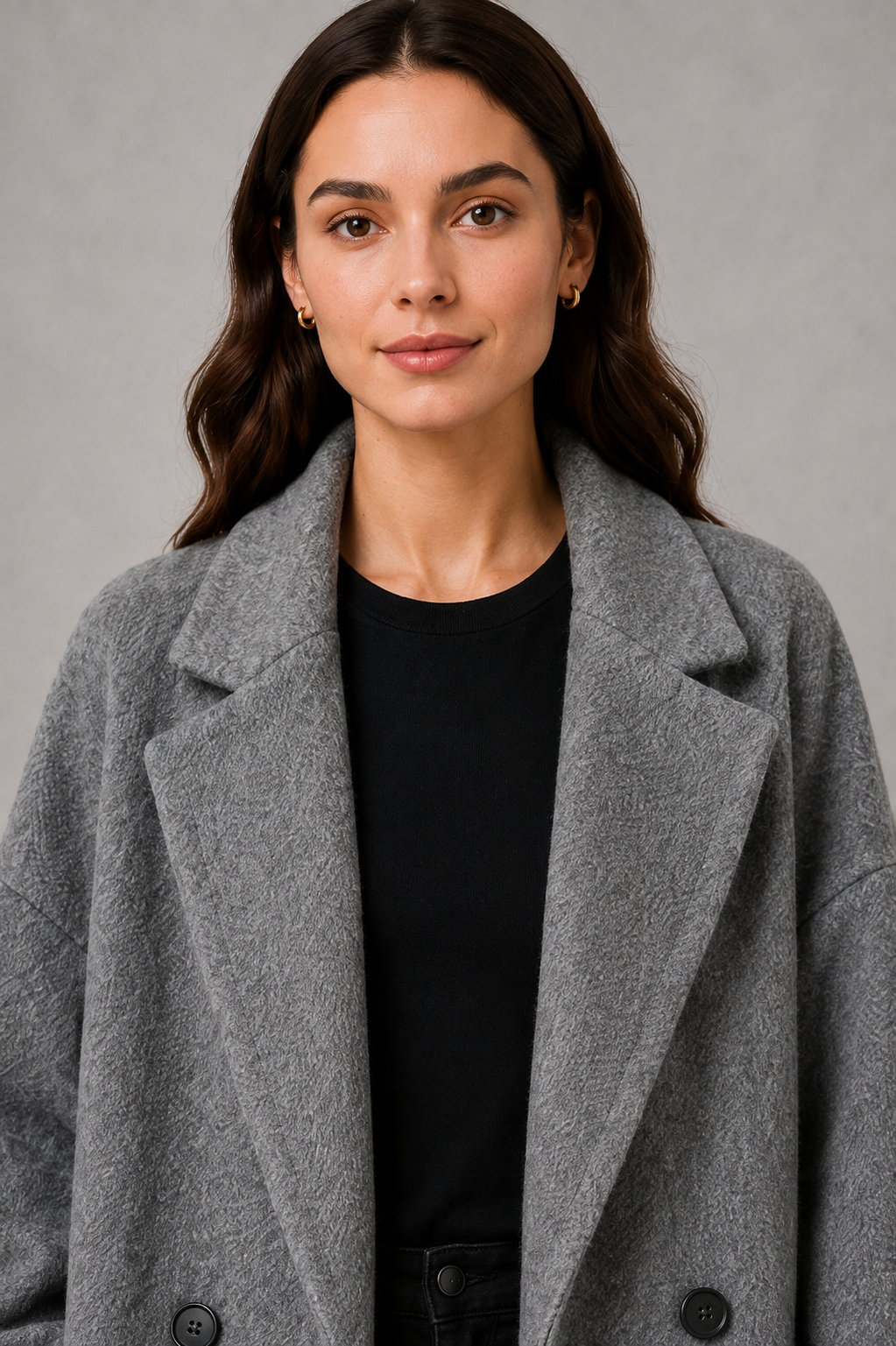 Women’s classic wool maxi coat with a relaxed longline silhouette, traditional button-front closure and clean minimalist finish.