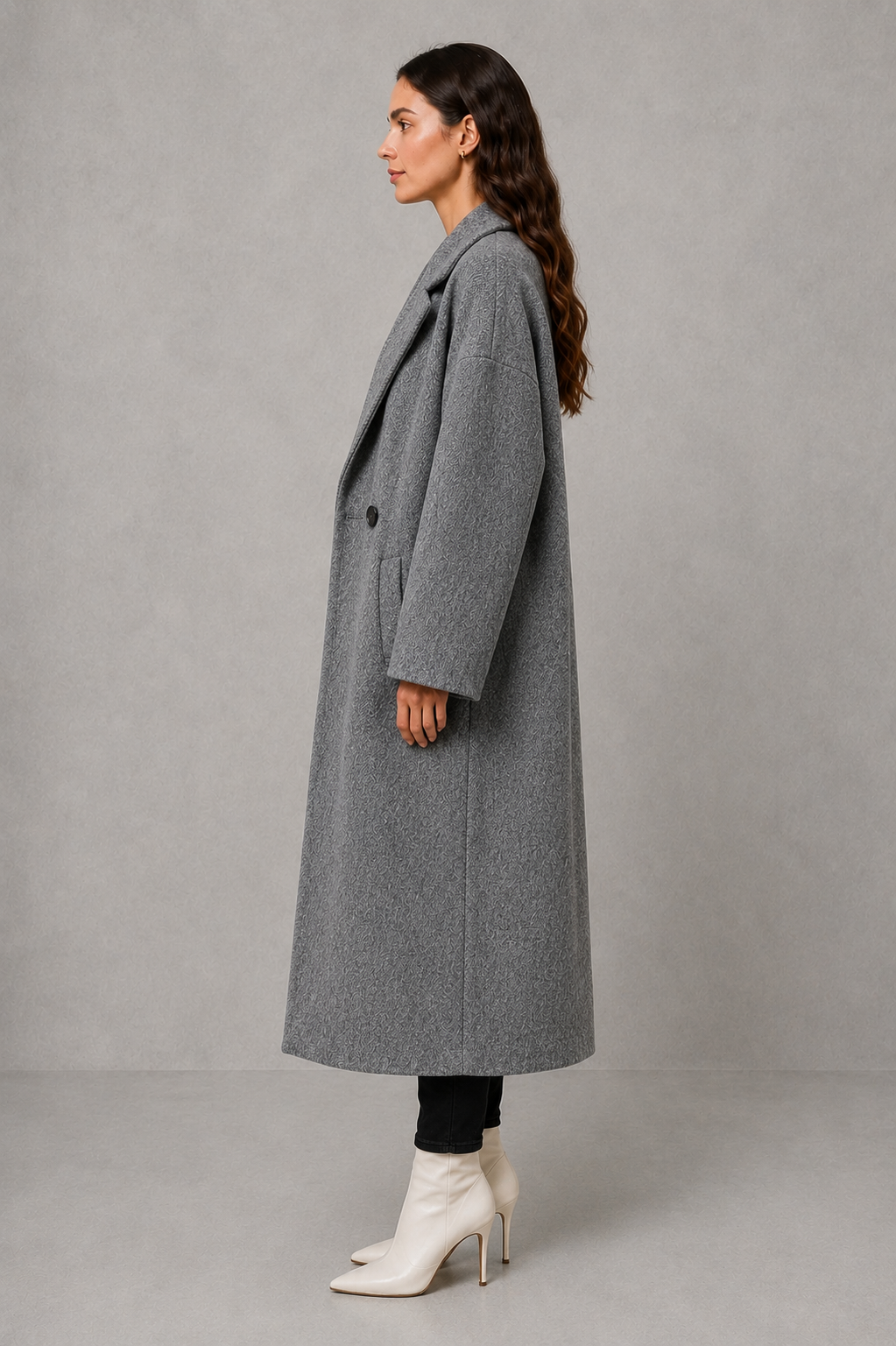 Women’s classic wool maxi coat with a relaxed longline silhouette, traditional button-front closure and clean minimalist finish.