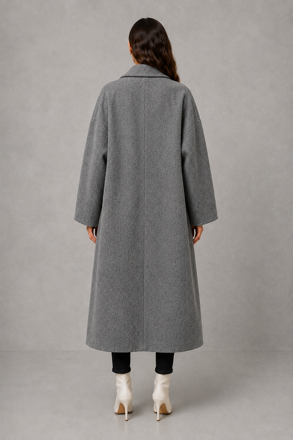 Women’s classic wool maxi coat with a relaxed longline silhouette, traditional button-front closure and clean minimalist finish.