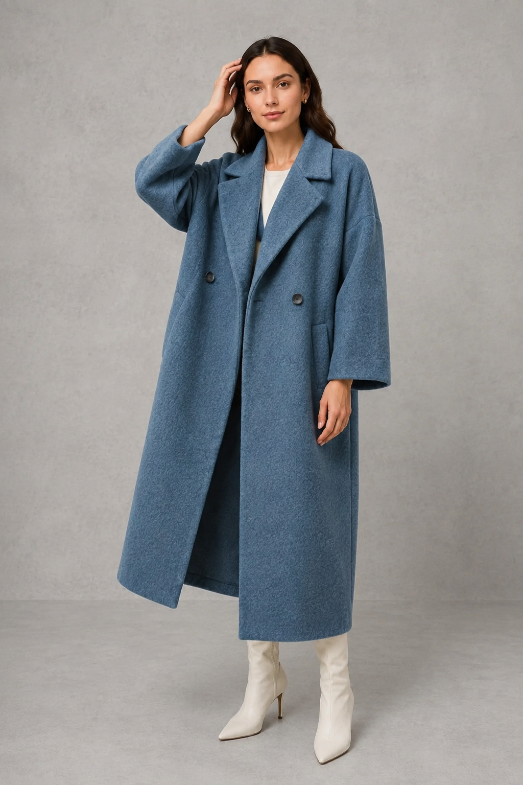 Women’s classic wool maxi coat with a relaxed longline silhouette, traditional button-front closure and clean minimalist finish.