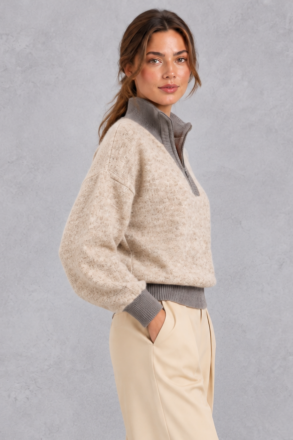 Half zip pullover sweater worn open with jeans, styled look
