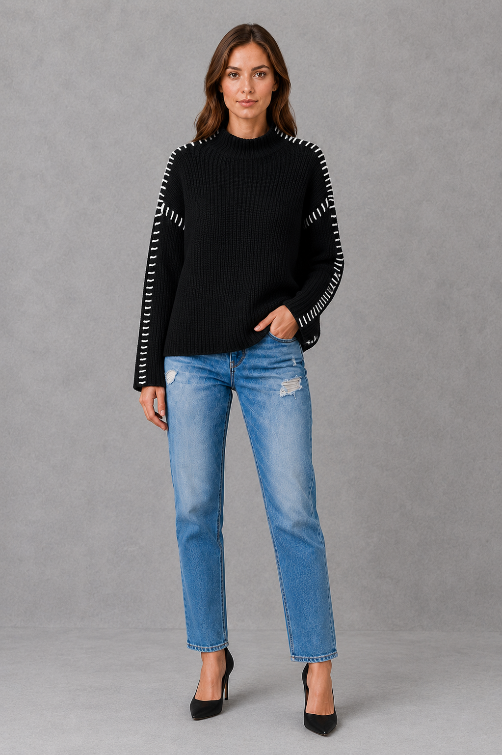 Women’s black oversized crew neck sweater with long sleeves and statement white contrast stitching along the shoulders and sleeves.