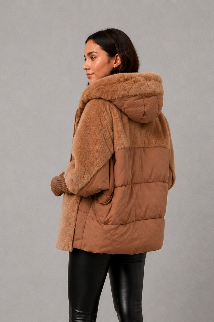 Women’s cozy hooded longline coat with a soft inner lining, attached hood, smooth outer fabric, and comfortable regular fit for winter layering.