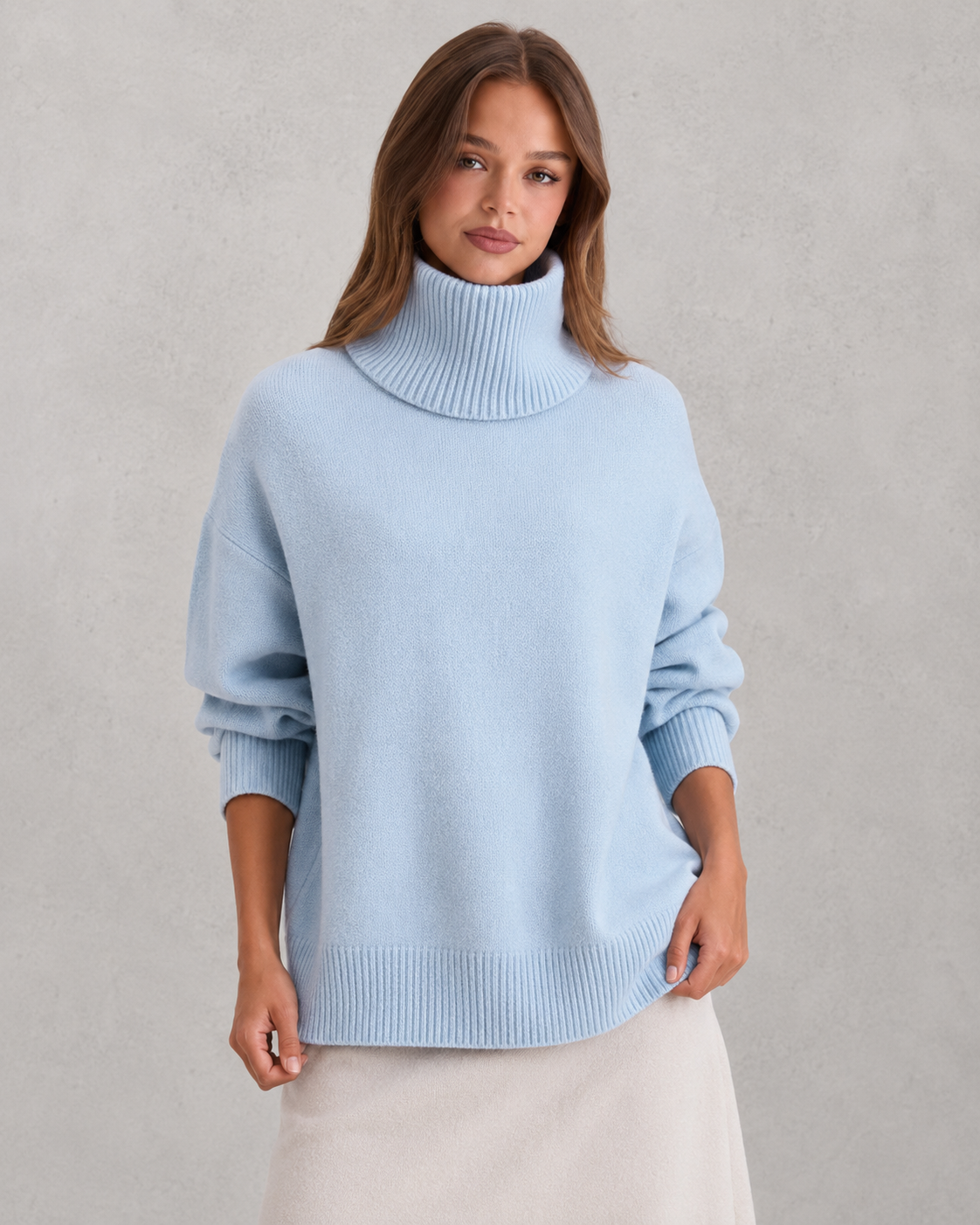 Women's cozy knitted turtleneck sweater in a relaxed, feminine silhouette with a softly structured fit. Features a refined high neckline, rich textured knit, and clean minimalist design that offers warmth and breathable comfort. A versatile wardrobe essential styled effortlessly with tailored trousers, denim, boots, or accessories for polished everyday wear from office settings to casual outings.