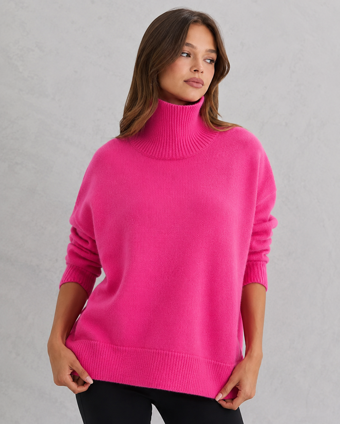 Women's cozy knitted turtleneck sweater in a relaxed, feminine silhouette with a softly structured fit. Features a refined high neckline, rich textured knit, and clean minimalist design that offers warmth and breathable comfort. A versatile wardrobe essential styled effortlessly with tailored trousers, denim, boots, or accessories for polished everyday wear from office settings to casual outings.