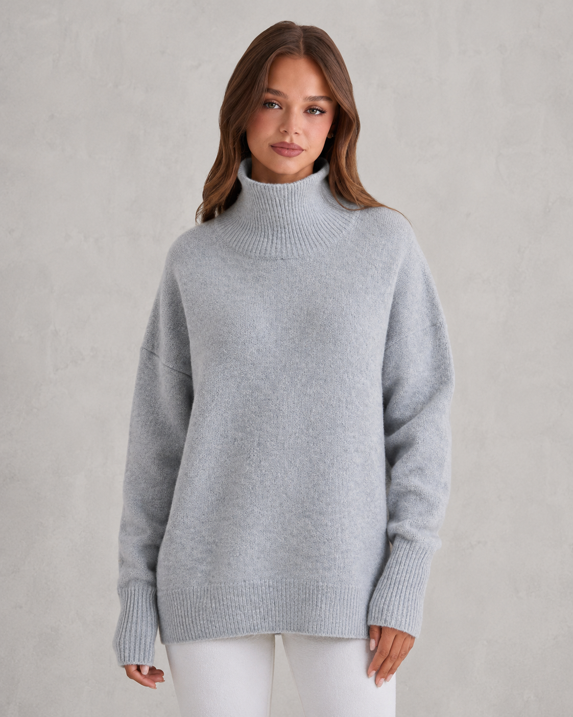 Women's cozy knitted turtleneck sweater in a relaxed, feminine silhouette with a softly structured fit. Features a refined high neckline, rich textured knit, and clean minimalist design that offers warmth and breathable comfort. A versatile wardrobe essential styled effortlessly with tailored trousers, denim, boots, or accessories for polished everyday wear from office settings to casual outings.