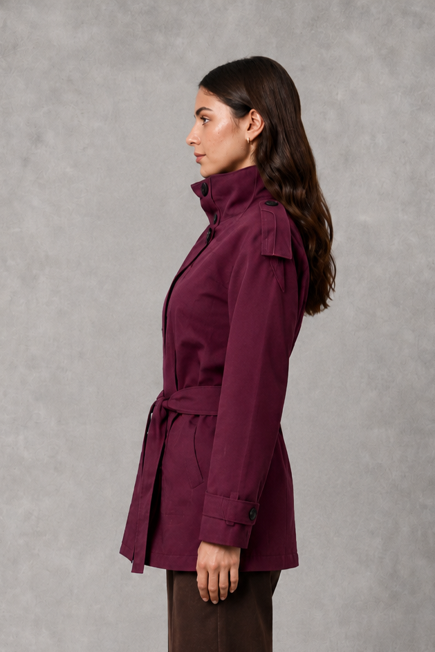 Women’s cropped double-breasted jacket with a high collar, statement buttons, adjustable waist belt, and softly structured lightweight silhouette.