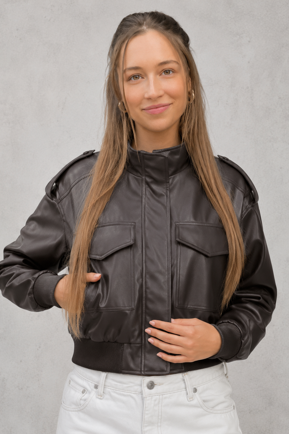 Women’s cropped faux leather bomber jacket with zip-front closure, functional pockets, ribbed cuffs and hem, and a relaxed leather-look finish.