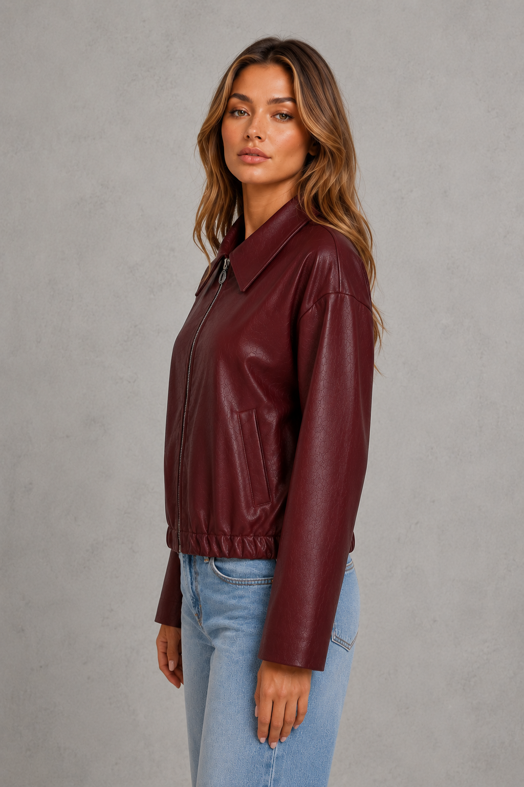 Women’s cropped faux leather jacket with zip front, oversized pointed collar, elasticized hem, and side pockets in a relaxed fit.