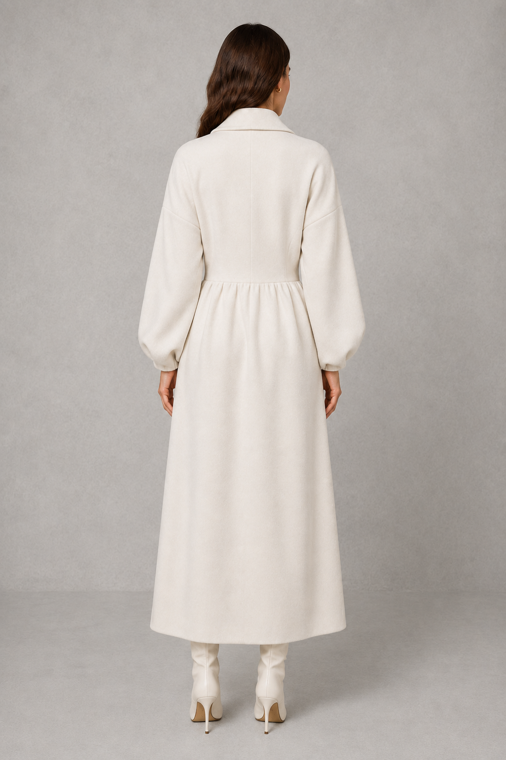 Women’s double-breasted long coat with an elegant longline length, structured tailored silhouette, soft fabric, and classic double-breasted front.