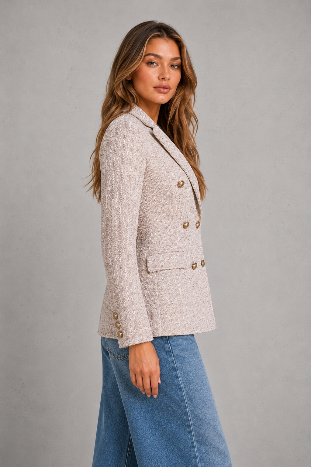 Women’s double-breasted tweed blazer with textured fabric, gold-tone buttons, classic notched lapels, and a structured tailored silhouette.