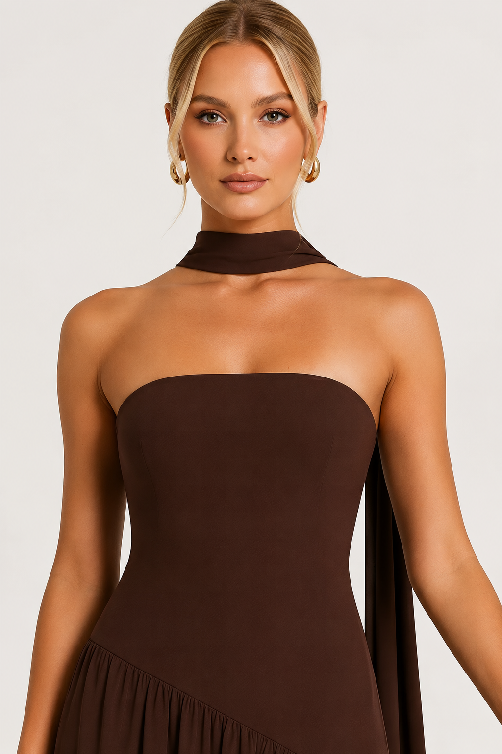 Women's strapless draped satin maxi dress with a fitted bodice and flowing full-length skirt, creating an elegant silhouette ideal for formal events, evening occasions, and celebrations.