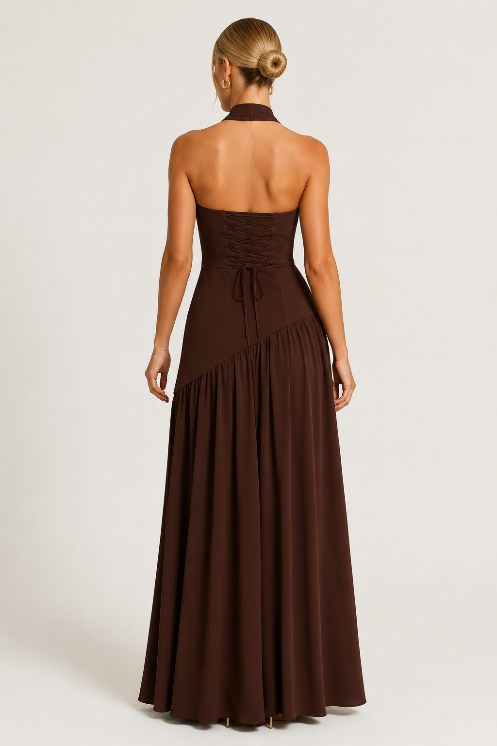 Women's strapless draped satin maxi dress with a fitted bodice and flowing full-length skirt, creating an elegant silhouette ideal for formal events, evening occasions, and celebrations.