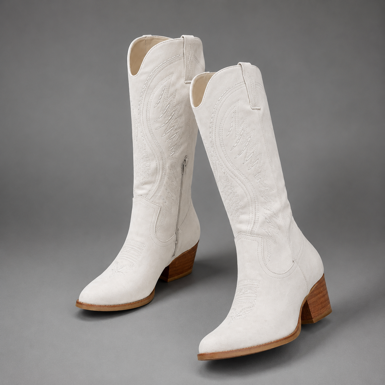 Women's embroidered western cowboy boots with a suede-look finish, knee-high silhouette, mid heel and side zip fastening for stylish everyday autumn and winter wear.