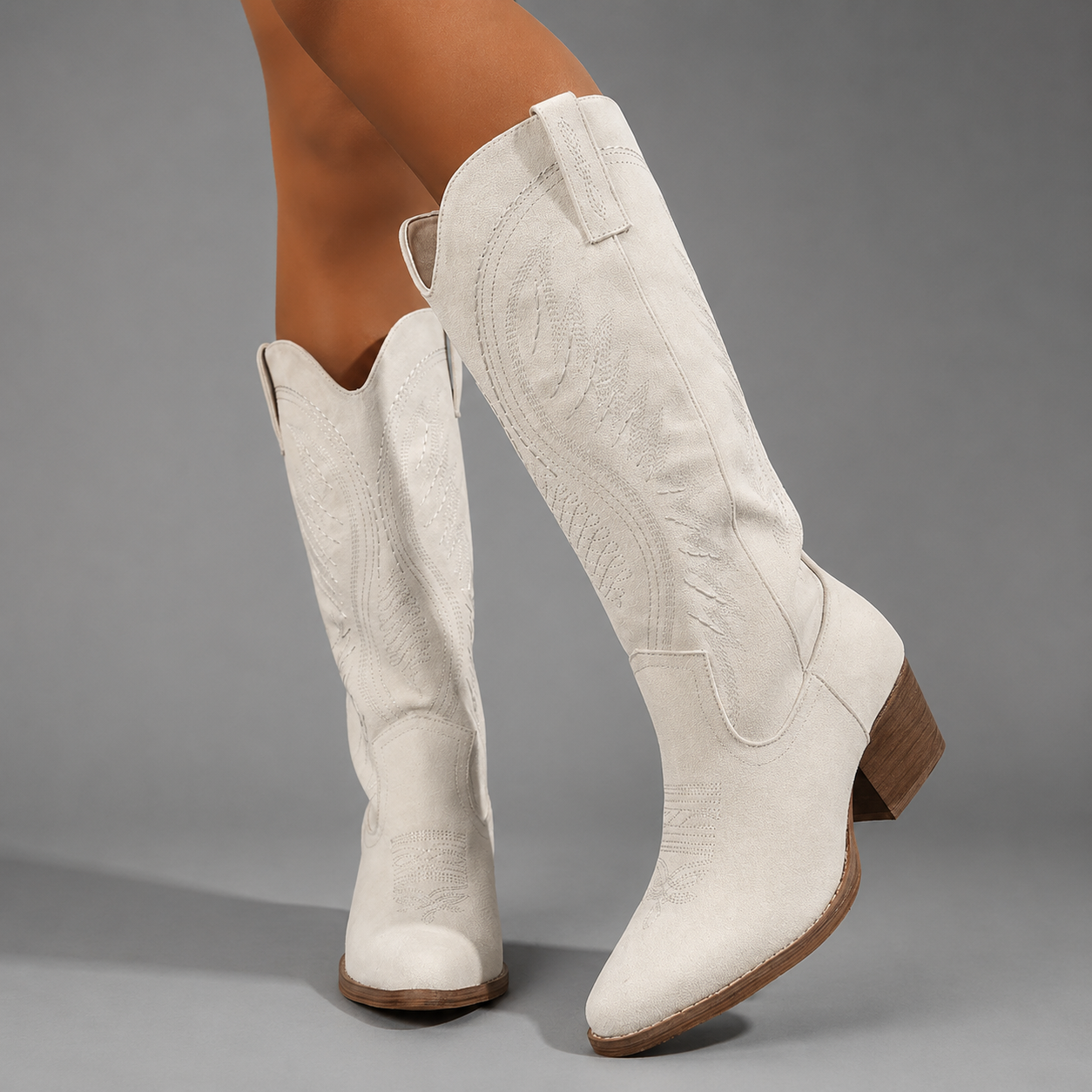 Women's embroidered western cowboy boots with a suede-look finish, knee-high silhouette, mid heel and side zip fastening for stylish everyday autumn and winter wear.