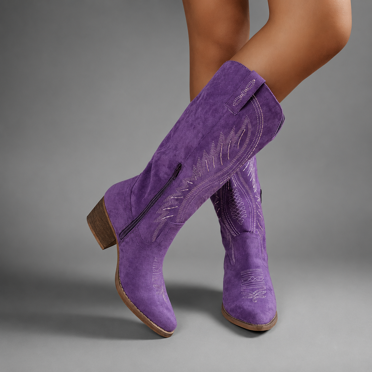 Women's embroidered western cowboy boots with a suede-look finish, knee-high silhouette, mid heel and side zip fastening for stylish everyday autumn and winter wear.