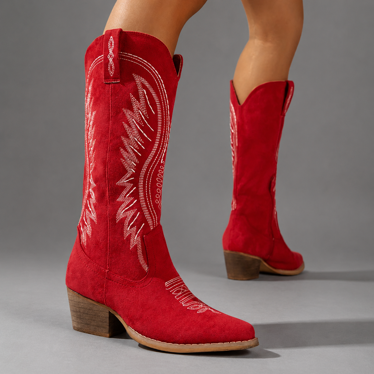 Women's embroidered western cowboy boots with a suede-look finish, knee-high silhouette, mid heel and side zip fastening for stylish everyday autumn and winter wear.