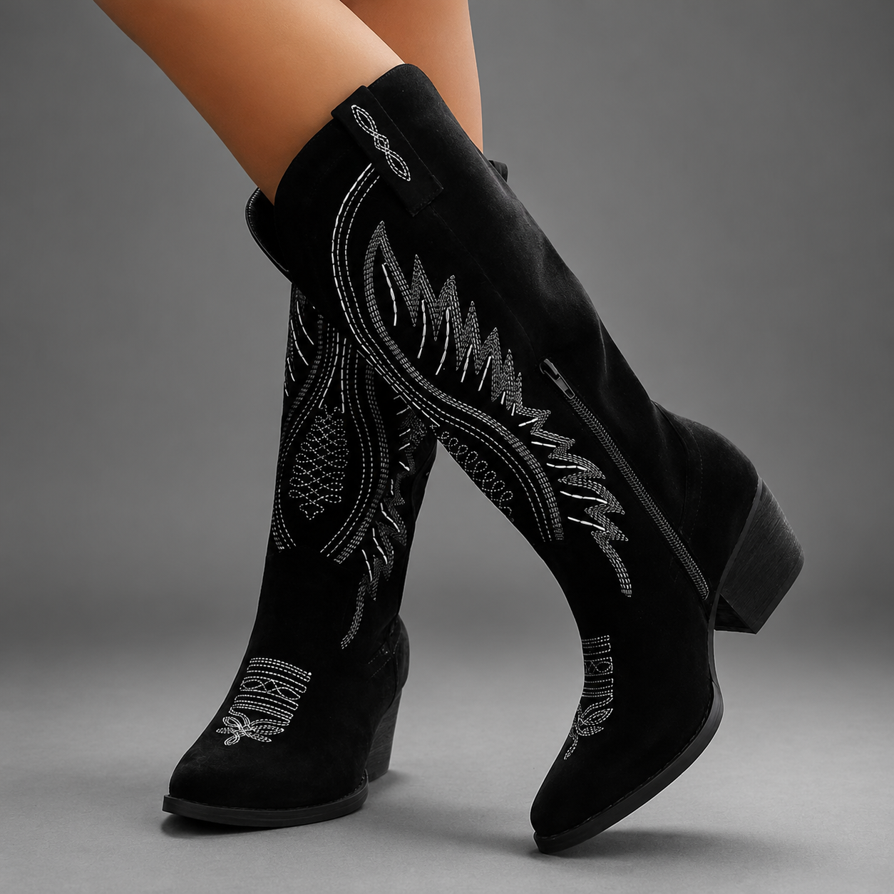 Women's embroidered western cowboy boots with a suede-look finish, knee-high silhouette, mid heel and side zip fastening for stylish everyday autumn and winter wear.