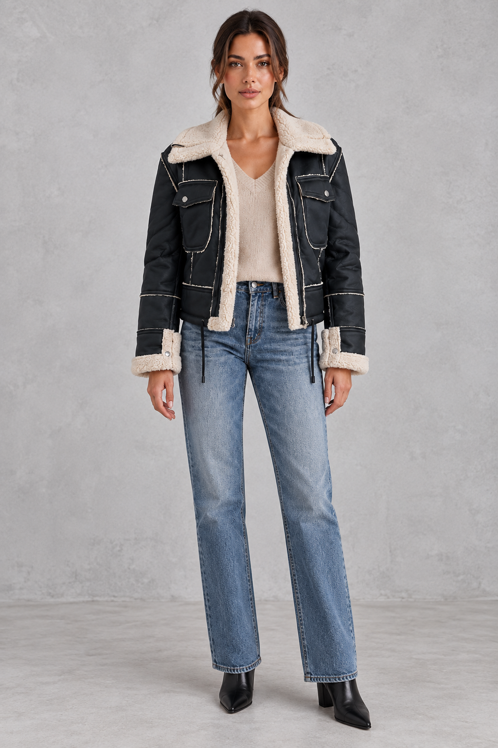 Black aviator jacket styled with jeans and boots