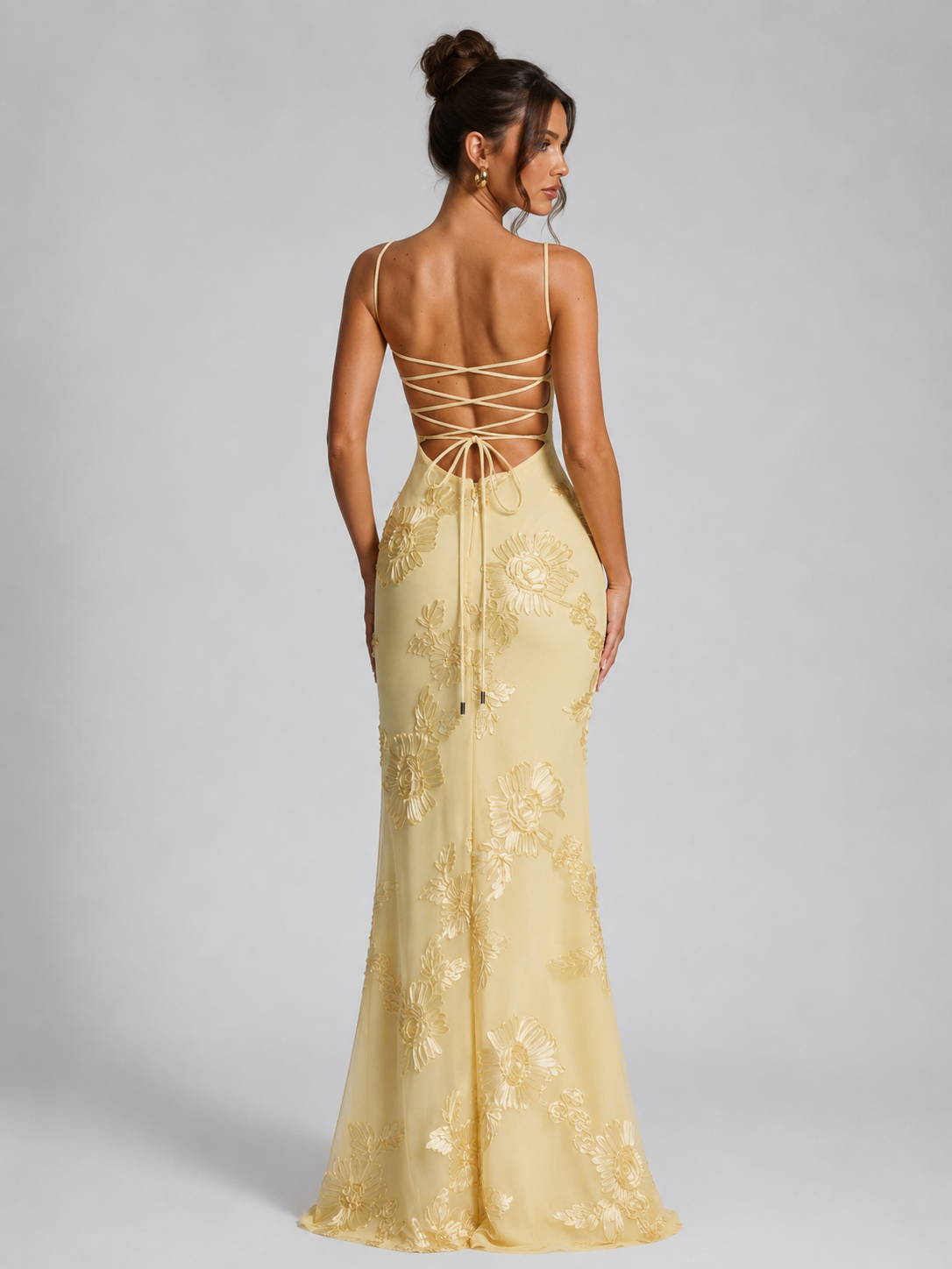 Women's floral embroidered corset maxi dress featuring a fitted corset-inspired bodice, delicate shoulder straps, textured floral embroidery, and a flowing maxi skirt, ideal for weddings, formal events, and special occasions.