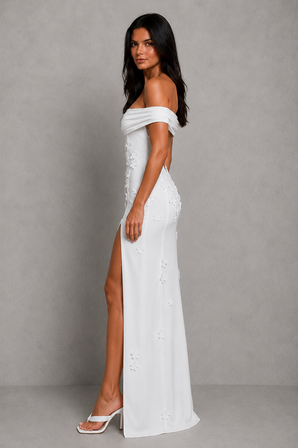 Women's floral mesh Bardot maxi dress featuring elegant 3D floral appliqués, an off-the-shoulder neckline, fitted bodice, open low-back detail, flowing maxi skirt, thigh-high split, and soft stretch mesh fabric for formal occasions and evening events.