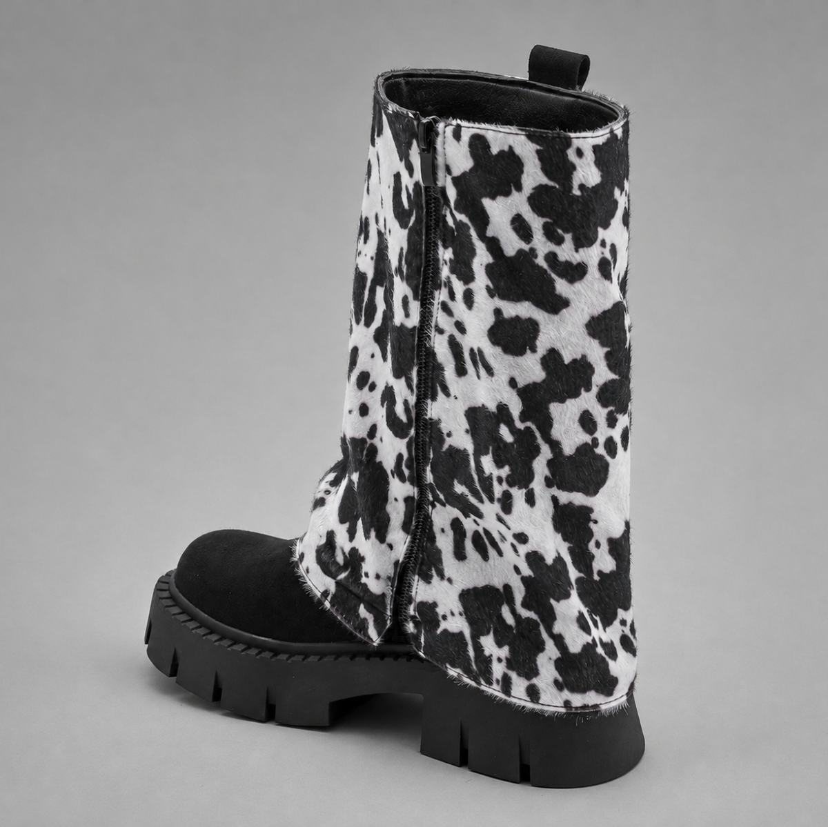 Women’s genuine leather knee-high biker boots with a supple leather upper, long external zipper, double buckle accents, and sturdy sole.