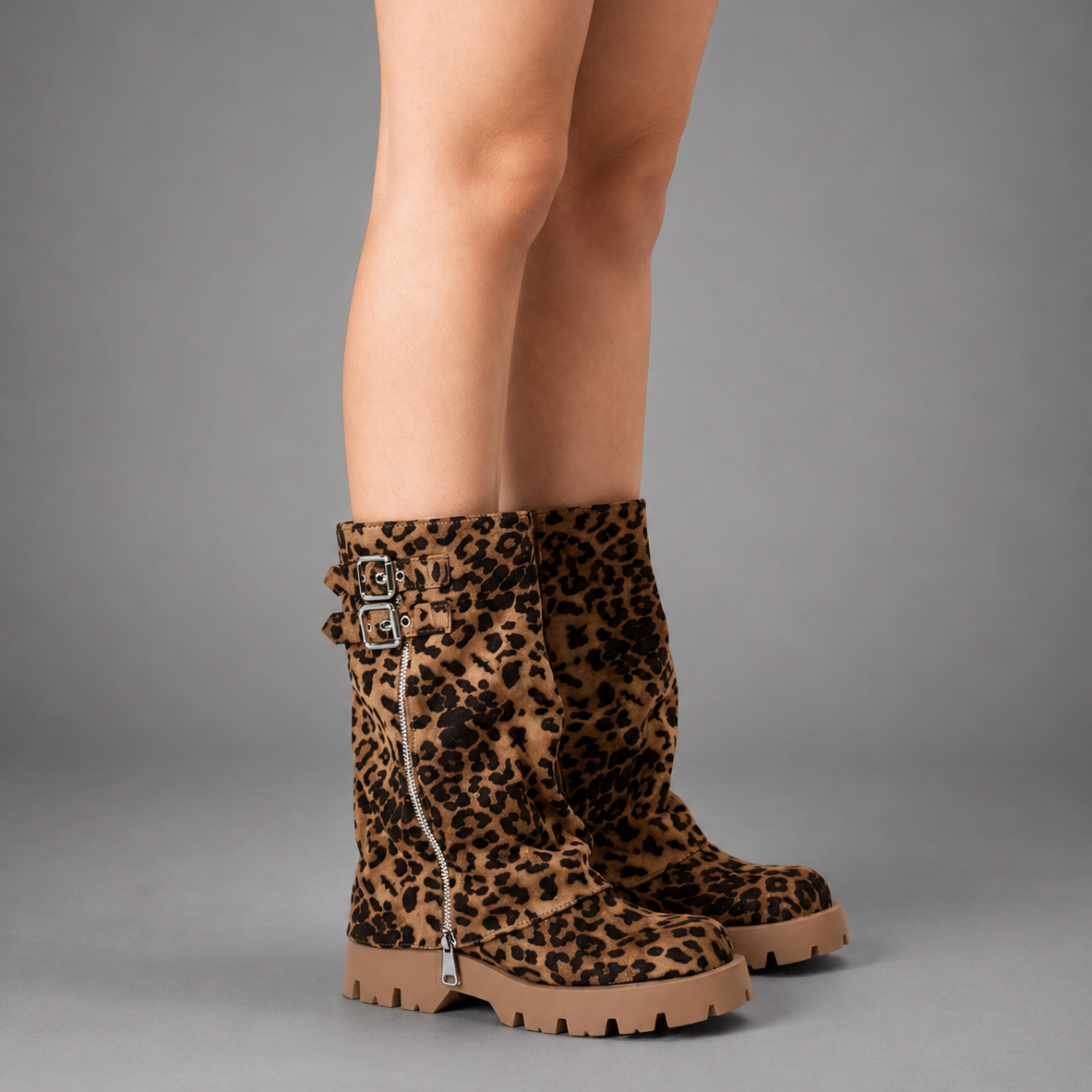 Women’s genuine leather knee-high biker boots with a supple leather upper, long external zipper, double buckle accents, and sturdy sole.