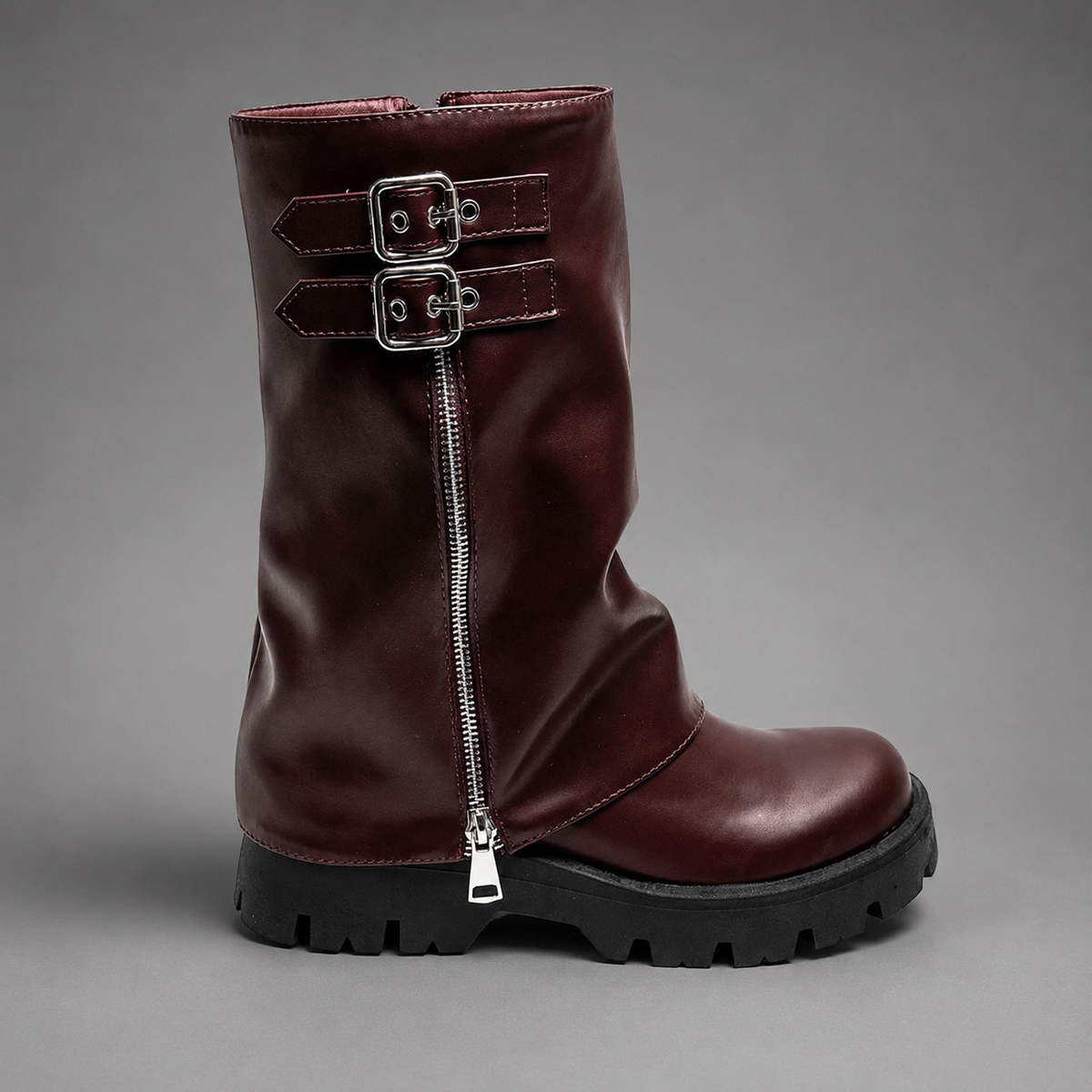 Women’s genuine leather knee-high biker boots with a supple leather upper, long external zipper, double buckle accents, and sturdy sole.