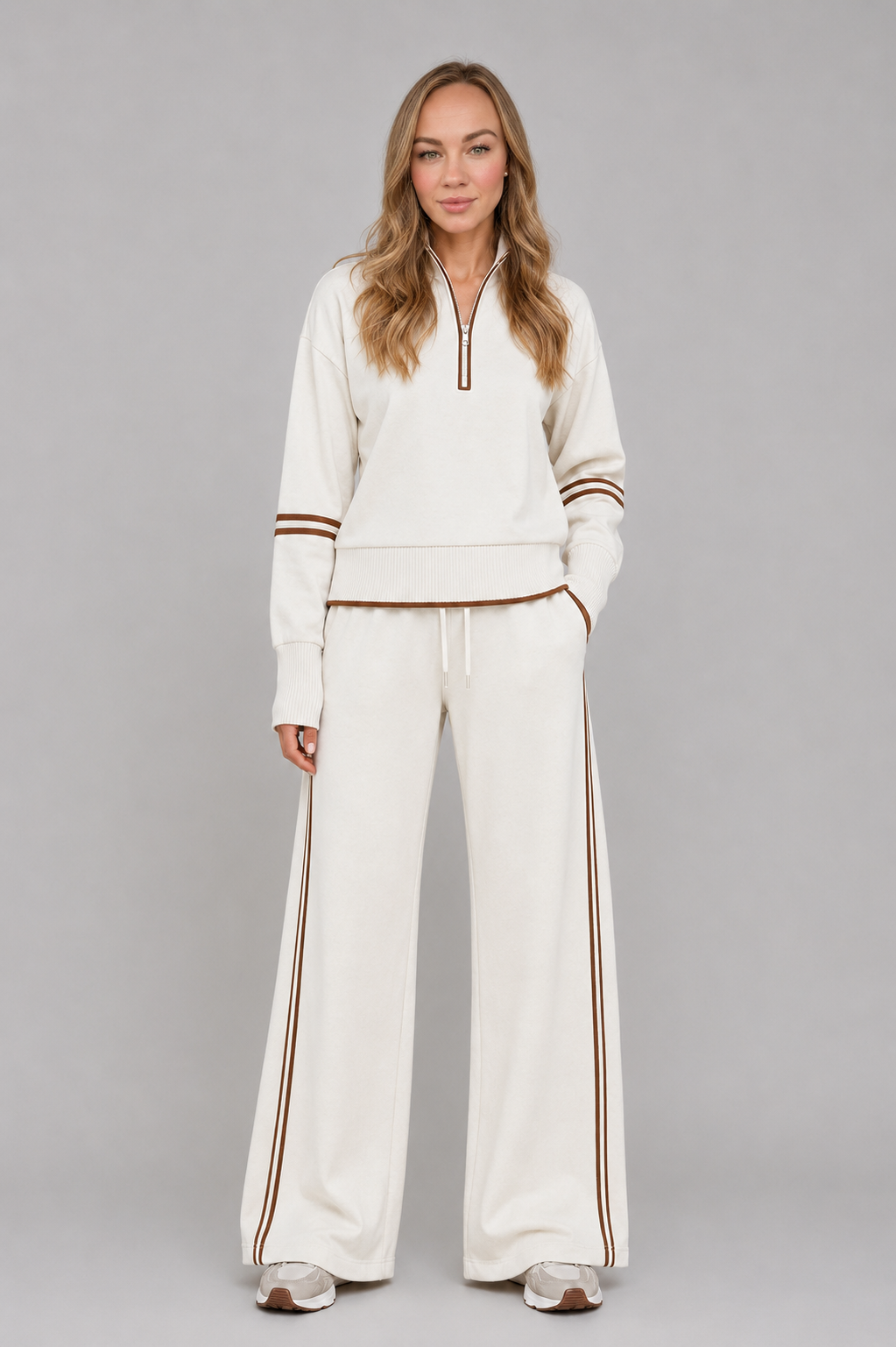 Women’s half-zip lounge set with a relaxed funnel-neck sweatshirt, contrast stripe detailing, and matching wide-leg drawstring pants.