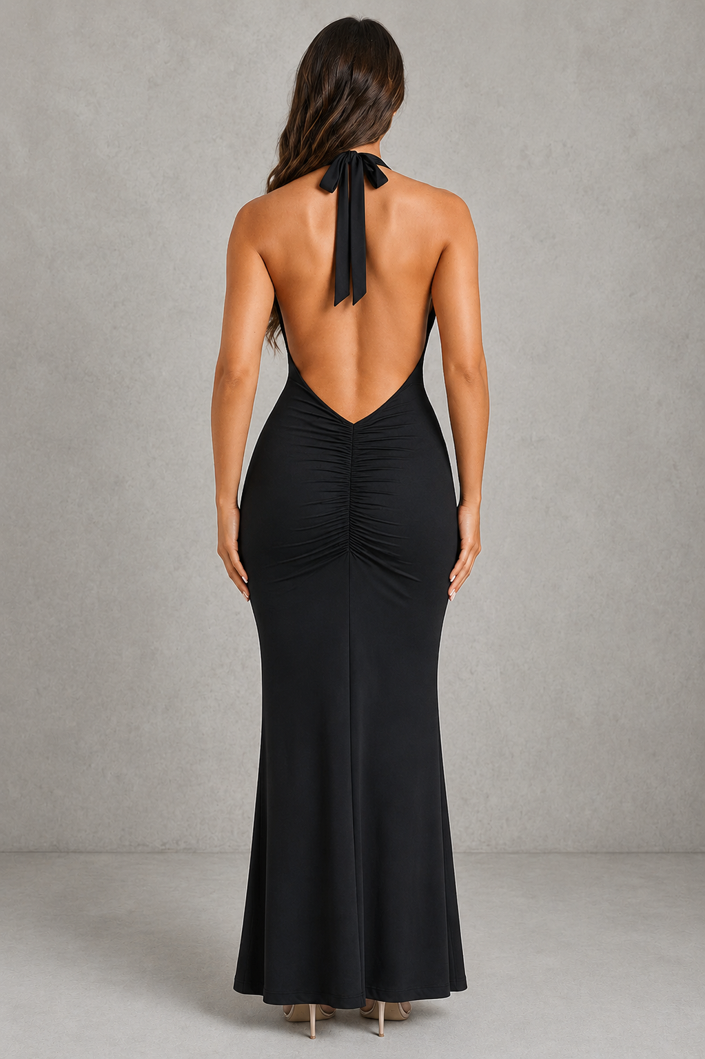 Women’s halter jersey maxi dress with plunge neckline, flattering pleated detailing and elegant low V-back for evening and formal occasions.