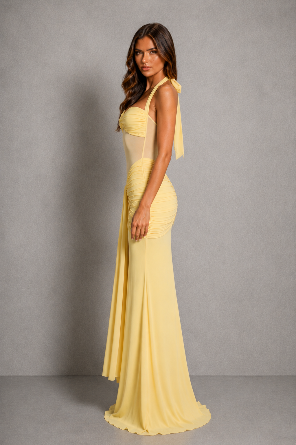 Women’s halter mesh maxi dress with sweetheart neckline, sheer bodice, ruched hip detail, and elegant fit-and-flare skirt.