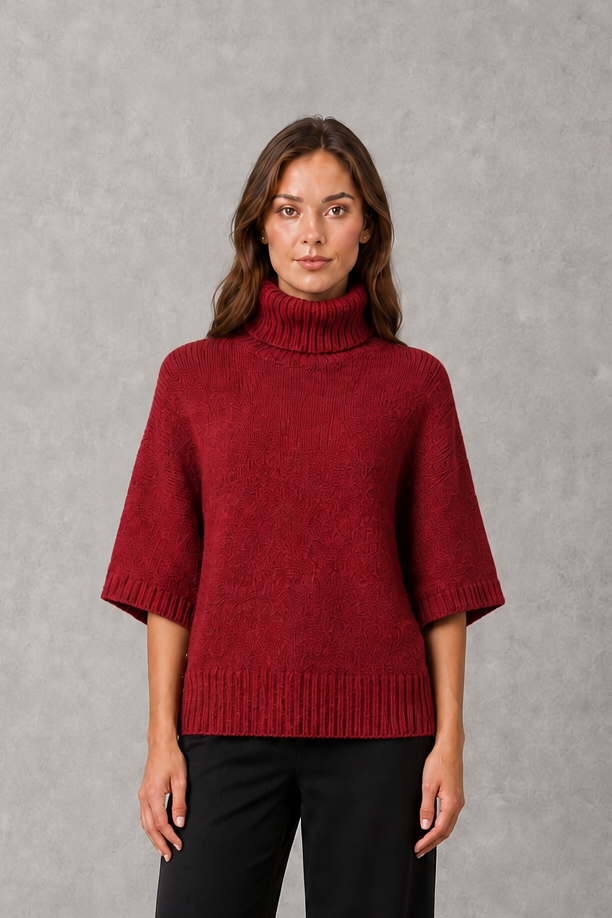 Women’s high neck batwing knit sweater with textured detailing, relaxed poncho-style silhouette, flowing sleeves, and a flattering waist-defining shape.
