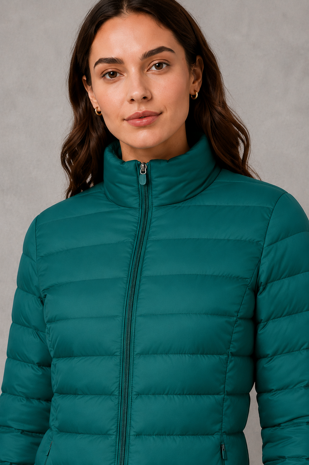 Women’s high neck quilted puffer jacket with horizontal quilting, lightweight insulated padding, zip-front closure, practical pockets, and a streamlined silhouette.