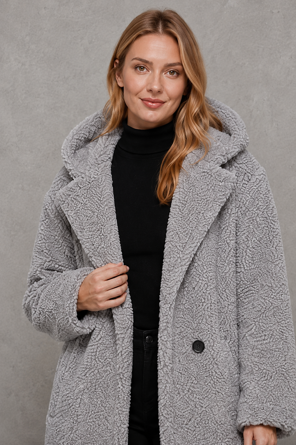 Women’s hooded quilted longline coat with soft insulated padding, a relaxed silhouette, protective hood and deep side pockets.